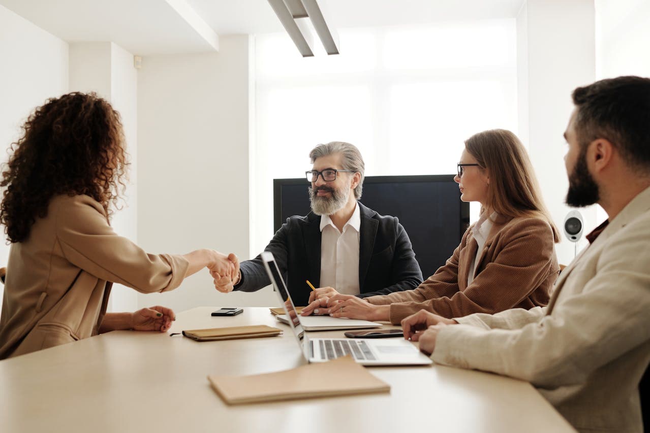 A recruiter opening a new role from a laptop